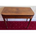 A 19thC rosewood & inlaid fold over card table on turned legs with baize lining to interior. 91 w