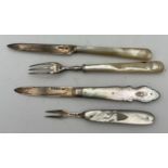 A silver and mother of pearl knife and fork Sheffield 1919, maker William Hutton and sons Ltd