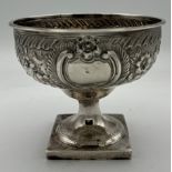 A silver pedestal bowl Dublin 1791, maker's mark I.I (unknown) with foliate repoussé decoration