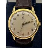 A Gentleman's Omega manual wristwatch, cream face with leather strap. case diameter measures approx.