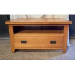 Oak TV stand with shelf and one long drawer. 57 h x102 w x 51cm d.