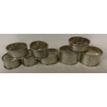 Eight silver napkin rings total weight 100gms Birmingham 1932, 5 matching and 3 individual.