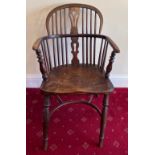 A 19thC Windsor armchair with crinoline stretcher. 89 x 52cm.