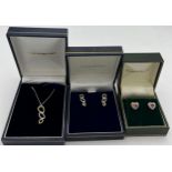 Goldsmiths 18 carat gold and diamond pendant and matching earrings in original boxes together with 9