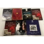 Various commemorative coin booklets, each holding one coin, to include "A War to end all Wars" x