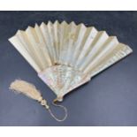 A 19th C mother of pearl and silk embroidered fan in original box.