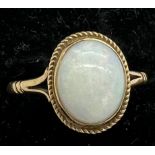 A nine carat gold ring set with opal. Total weight 1.7gm. Size O.