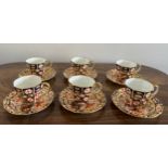 A Royal Crown Derby coffee service comprising six cups and saucers. No. 2451