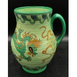 A Charlotte Rhead green vase for Crown Ducal with ribbed shape, Manchu dragon pattern and single