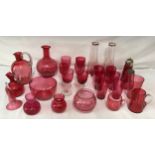 A collection of cranberry glass to include six wine glasses (various sizes), a decanter, seven water