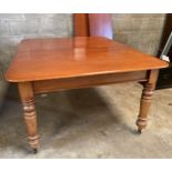 A Victorian mahogany pull out dining table with turned legs and two extra leaves. On castors. 73 h x