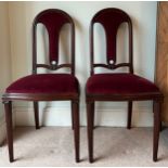 A pair of fine quality French mahogany side chairs with rope decoration and ionic column front legs.