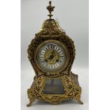 A 19thC French Buhl red tortoiseshell two train mantle clock striking on a gong. 38cm h.