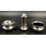 A silver cruet set two with blue glass liners two marked Birmingham 1918 the other Birmingham 1919