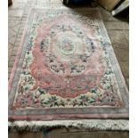 An Indian Imperial Jewel pink ground rug 255 x 155cm.