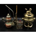 Oriental items to include a Chinese brass incense burner on three feet and stand, A Tibetan teapot