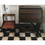 A child sized early 20thC roll top desk and chair. Desk 77 h x 52 w x 36cm d. Chair 55 h x 32cm w.