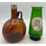 A 19thC amber glass flask with white metal mount, lacking stopper together with a Bohemian green