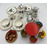 Two miniature tea services and a vintage wooden dolls house table 8cm d, chairs and tea service.