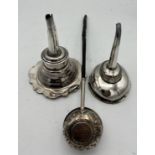 Two 19thC silver plated wine funnels with strainers together with a white metal and baleen toddy