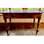 Edwardian oak two drawer writing table. 103cm w x 74cm h x 56cm d.