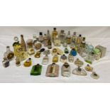 A collection of glass cosmetic bottles (some full, some empty) to include Dubarry Debonair, Sun Bath