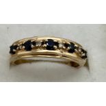A nine carat gold gem set ring. Weight 2.2gm. Size P.