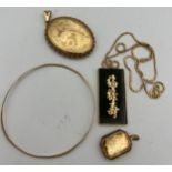 Nine carat gold bangle, 9 carat gold locket, unmarked yellow metal oval locket, chain marked 750,