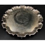 Silver tray 543gms 25cm diameter on three ornate feet, marked 925, maker's mark Carr's of