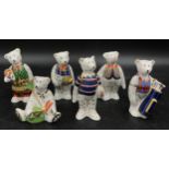 A collection of six Royal Crown Derby teddy bears to include Christmas Shopper, Golfer (with