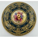A Royal Worcester cabinet plate decorated by E. Phillips. 23.5cm d.