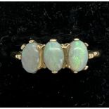 A three stone opal ring set in 9ct gold. Total weight 2.2gm. Size P.