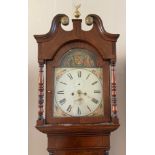 An 8 day long case oak clock with painted face with pendulum, weights key and winder approx. 230 h x