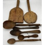 A collection of 18th and 19thC spoons and paddles.