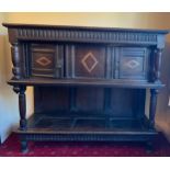 Oak two height chest with inlaid panels and carving to frieze, two cupboards to top. 133 h x 150 w x