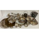 A large quantity of silver plated items to include entrée dishes, ice bucket, trays, wine coasters