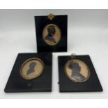 Three 19thC oval portrait silhouettes in similar ebonised fames. 14 x 16cms. One inscribed John Hall