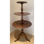 A mahogany three height dumb waiter on tripod base. 124cm h approx. 60cm d largest circle.