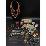 A quantity of costume jewellery to include necklaces some beaded some white metal, ear rings,