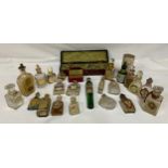 A collection of perfume bottles to include a boxed set of two small bottles by Girard et Cie, a