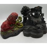 Three 19thC cast iron doorstops including a lion and snake marked Clark & co, wheat sheaf and a