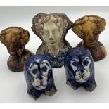 Nineteenth century pottery furniture rests, two pairs and a single. Three modelled as female