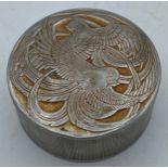 Designed by Rene Lalique for Roger Et Gallet, a round aluminium powder box with entwined bird
