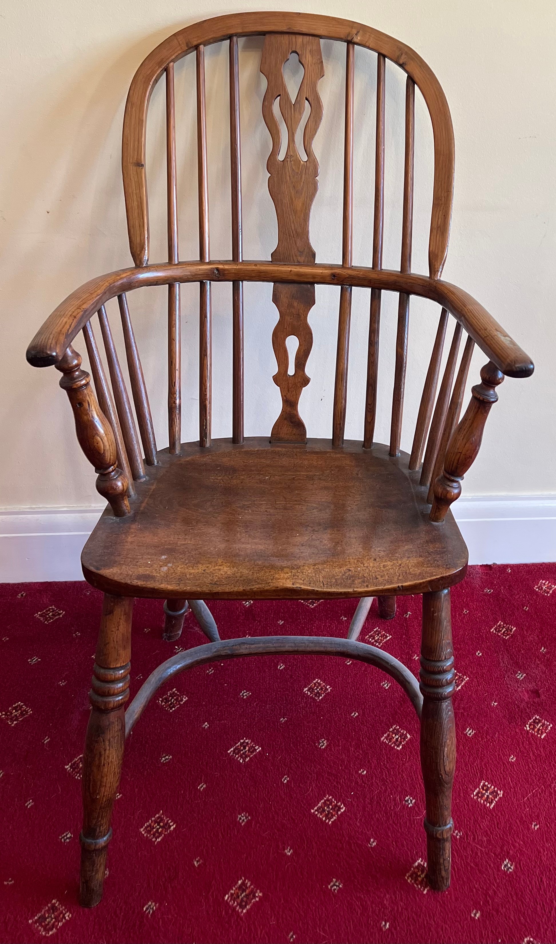 A 19thC Windsor armchair, high back with crinoline stretcher. 100 h x 56cm w.