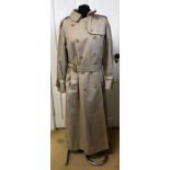 A vintage Burberry ladies trench coat with belt size 14 long L88D.