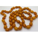 Two reconstituted amber necklaces approx. length 80 & 52cm. 213.9gm.