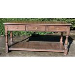 Oak three drawer side table. 152cm w x 45 d x 75 h.