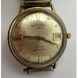 A gentleman's 9 carat gold cased Rotary wristwatch with date aperture on gold plated expanding