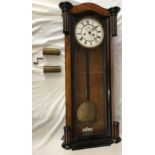 A walnut cased Vienna style regulator 8 day wall clock, the dial with Roman numerals and