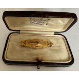 A Victorian 9 carat gold diamond set bar brooch, Chester 1899. In a fitted contemporary box.